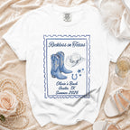 White t-shirt with "Reckless in Texas" and cowgirl boot graphic.