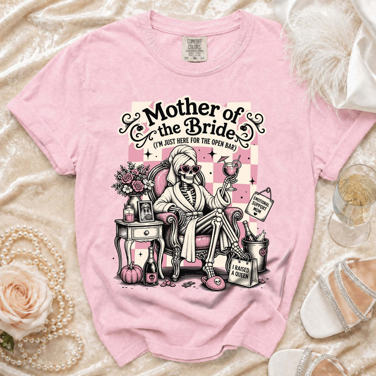 Pink t-shirt with skeleton graphic for "Mother of the Bride (I'm just here for the open bar)".