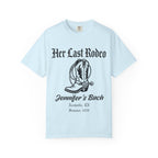 Light blue t-shirt with "Her Last Rodeo" and cowboy boot graphic.