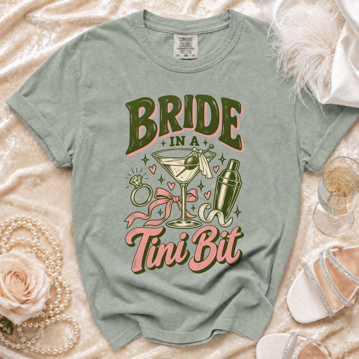 T-shirt with "Bride in a Tini Bit" text, martini, ring, and shaker graphic.