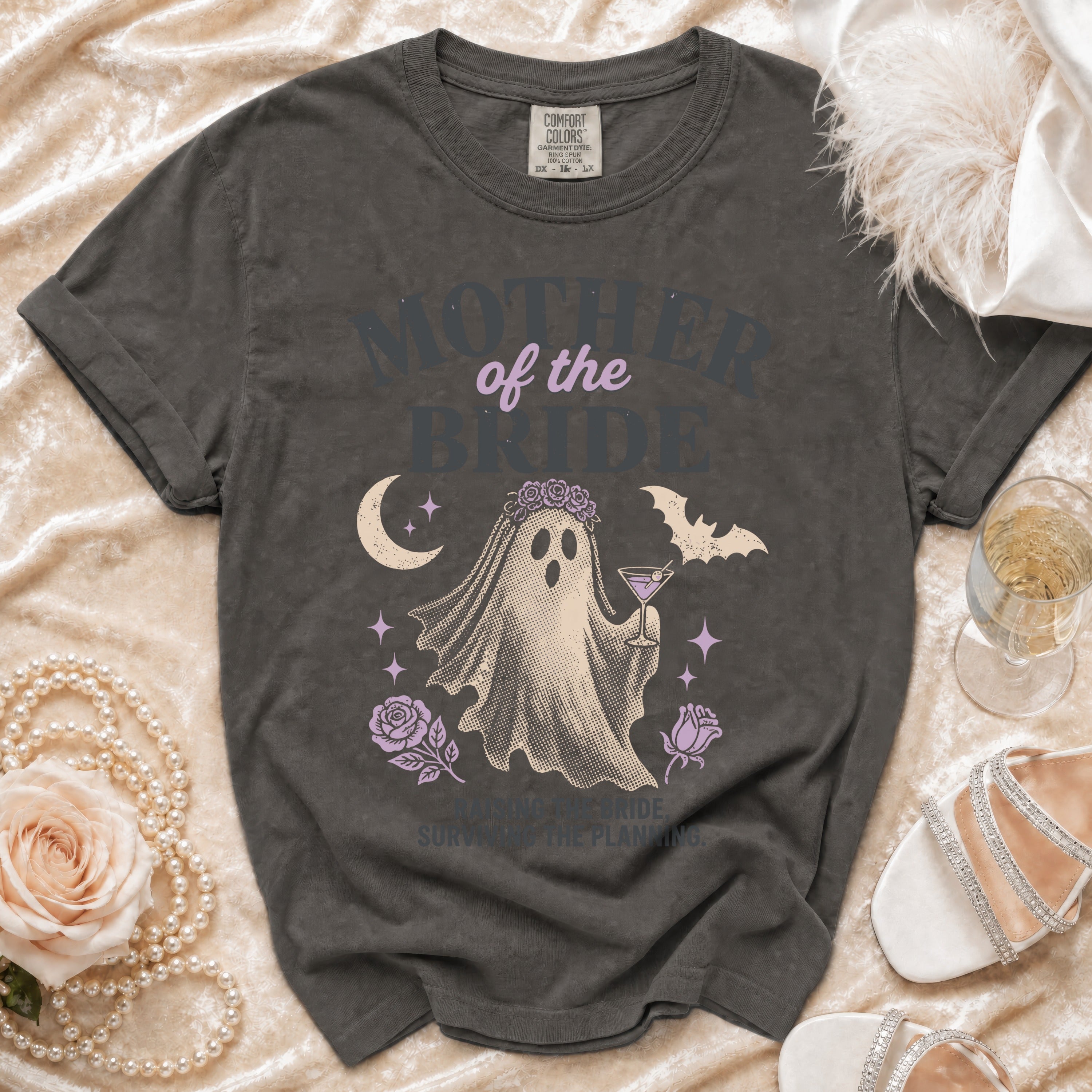 T-shirt with "Mother of the Bride, Surviving the Planning" text and ghost graphic.