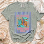 Bachelorette t-shirt with cowboy boots, hat, jacket, and text.