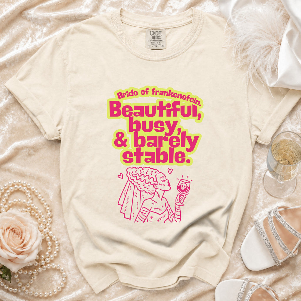 Cream t-shirt with Bride of Frankenstein text and illustration.