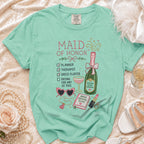 Maid of Honor t-shirt with checklist, champagne, and wedding accessories.