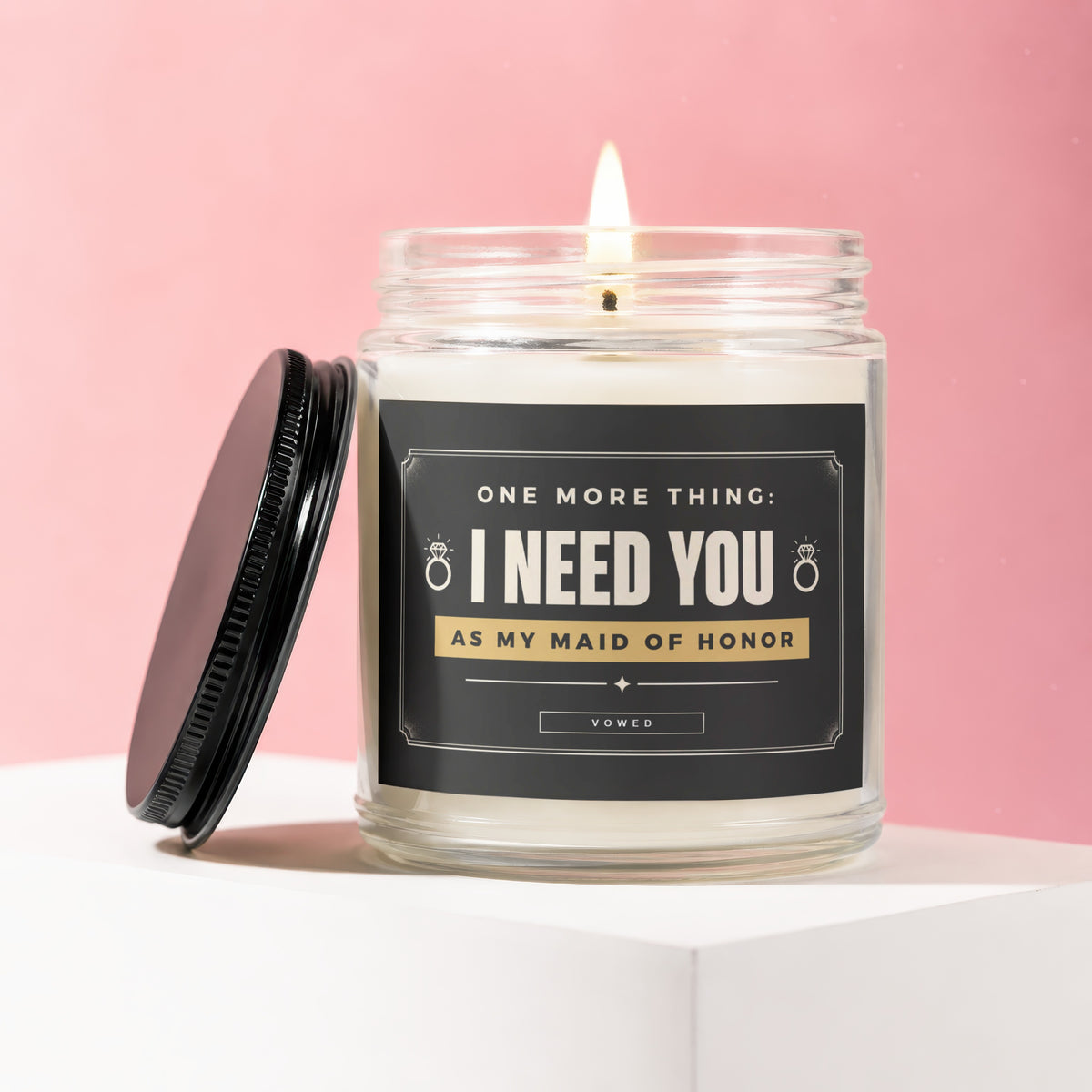 Candle with label reading "I NEED YOU AS MY MAID OF HONOR".