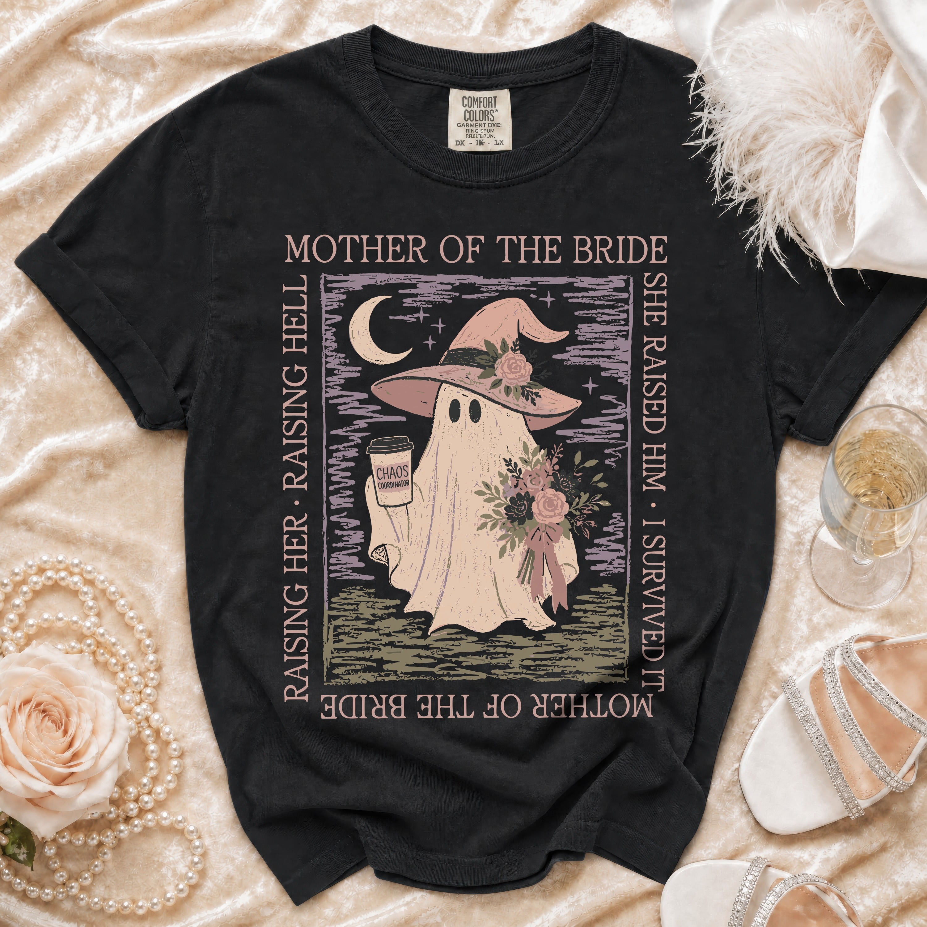 Black t-shirt with ghost in witch hat holding coffee, "Mother of the Bride" text.