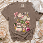 T-shirt with "Bride to Be" graphic featuring wedding items: car, cake, veil, ring, and champagne.
