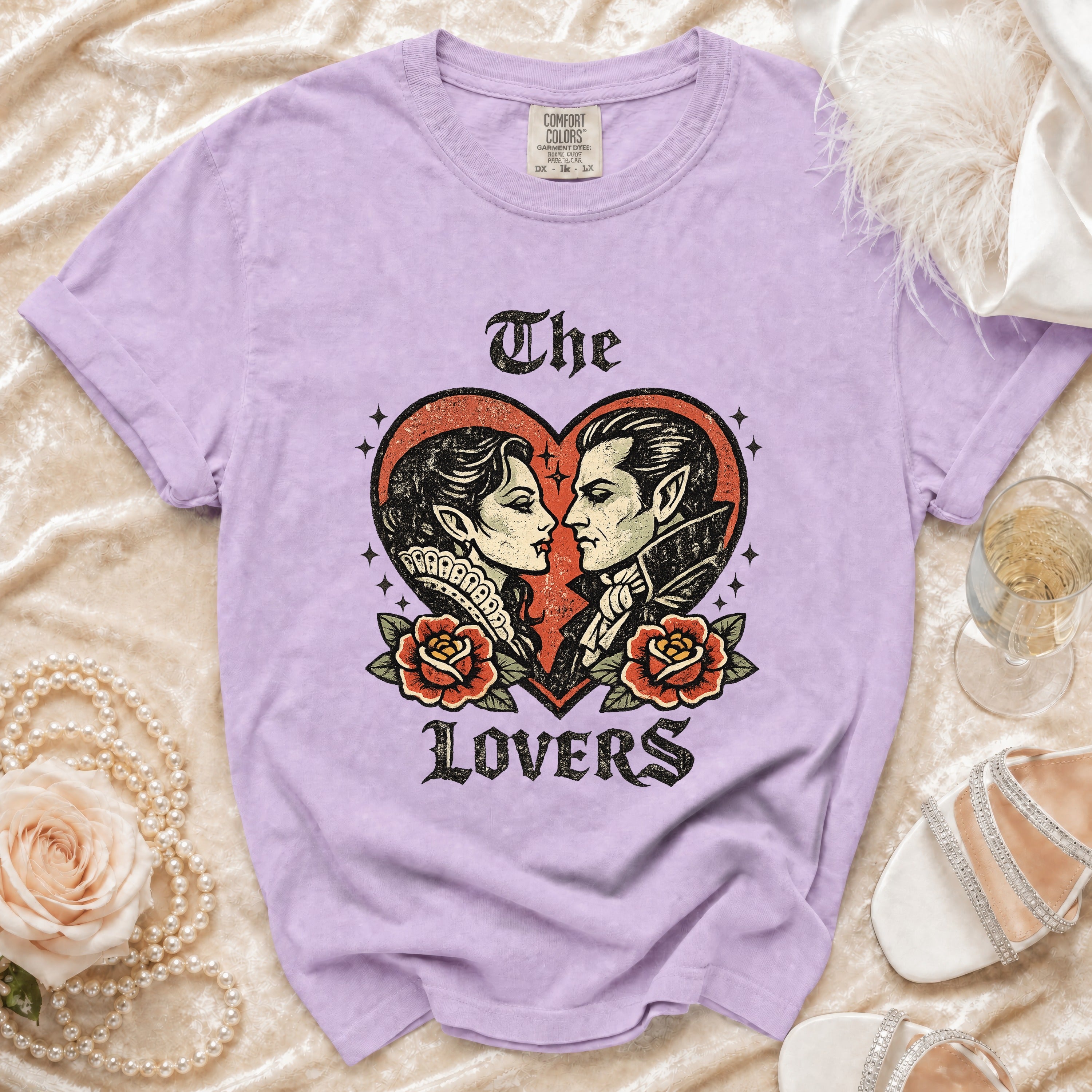 Purple t-shirt with vintage vampire couple and roses graphic, reads "The Lovers".