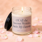 Glass candle with a lit wick and a label reading "Of All the Internet Weirdos, You're My Favorite."
