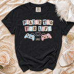 Black t-shirt with "Player Two For Life" text and gaming controllers.