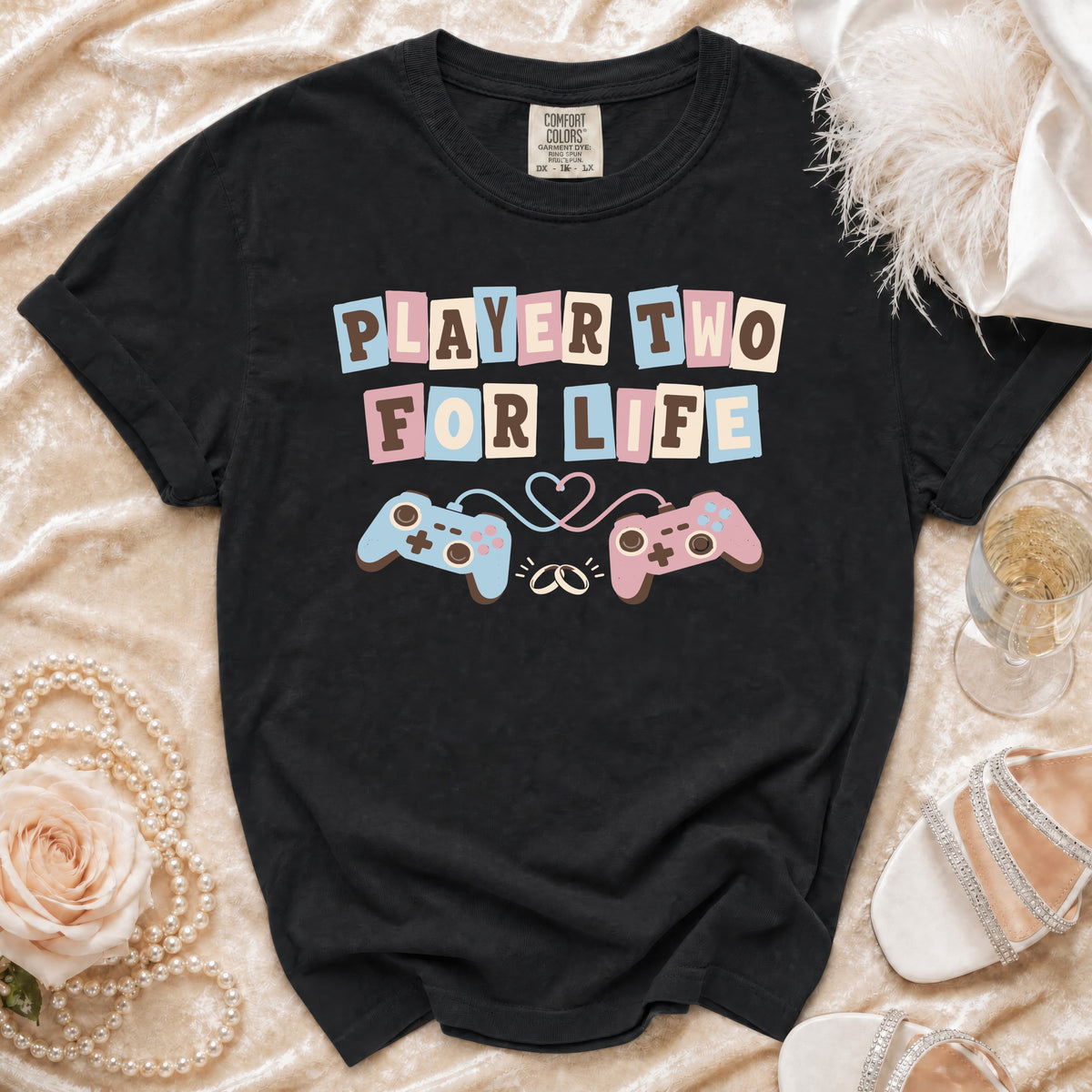 Black t-shirt with "Player Two For Life" text and gaming controllers.