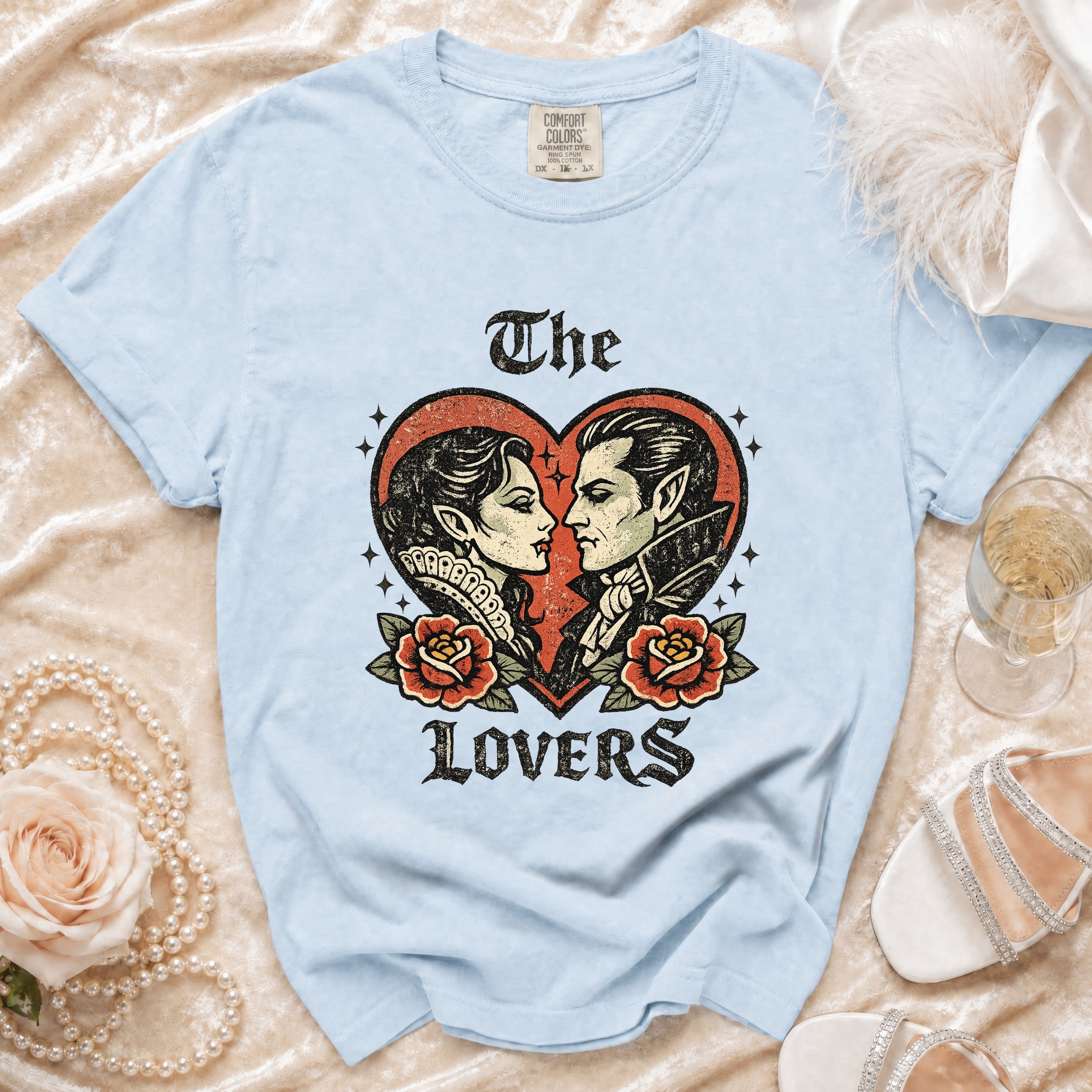 Light blue t-shirt with vampire couple and roses graphic, text "The Lovers".