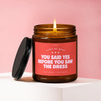 Amber jar candle with pink label reading "You Said Yes Before You Saw The Dress."