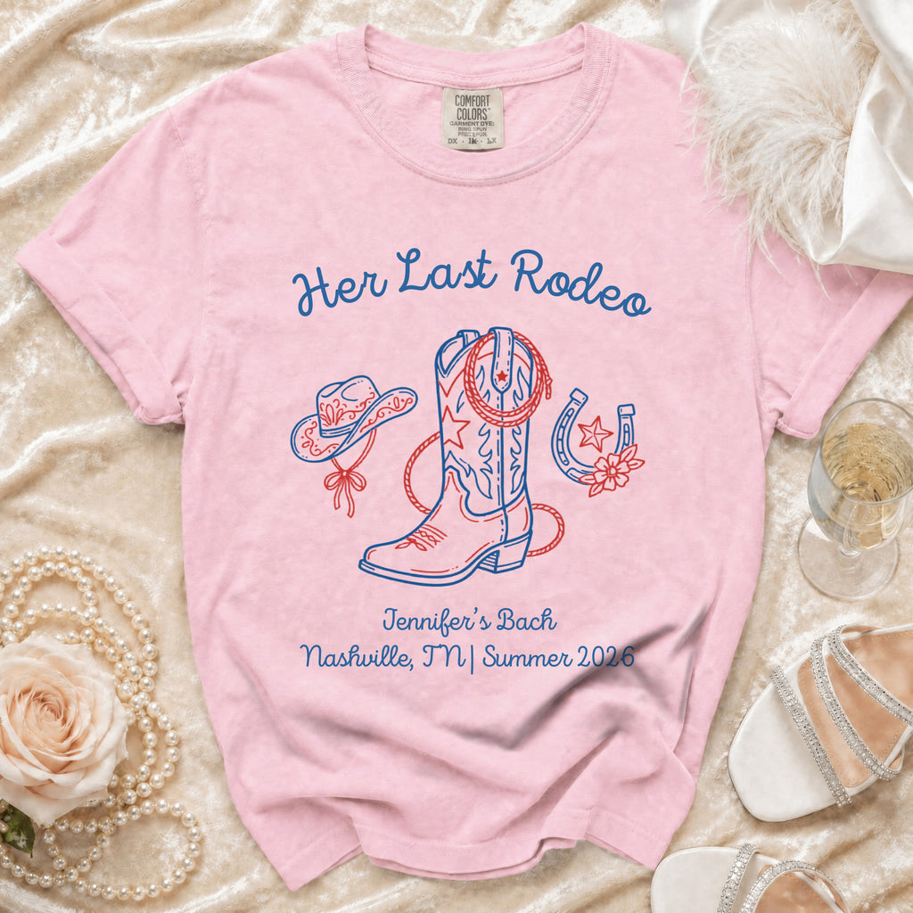 Pink t-shirt with "Her Last Rodeo" and cowboy boot, hat, horseshoe graphics.