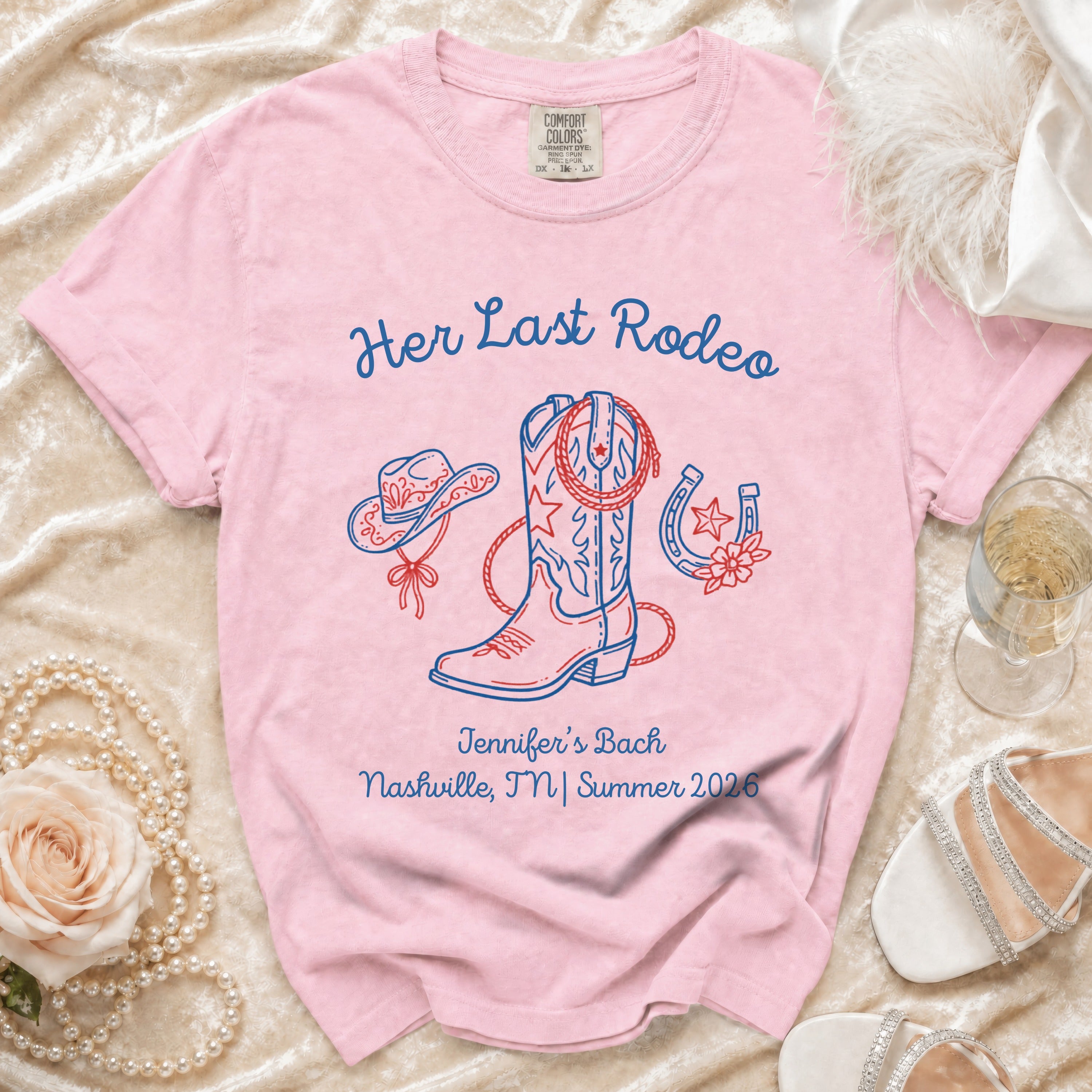 Pink t-shirt with "Her Last Rodeo" and cowboy boot, hat, horseshoe graphics.