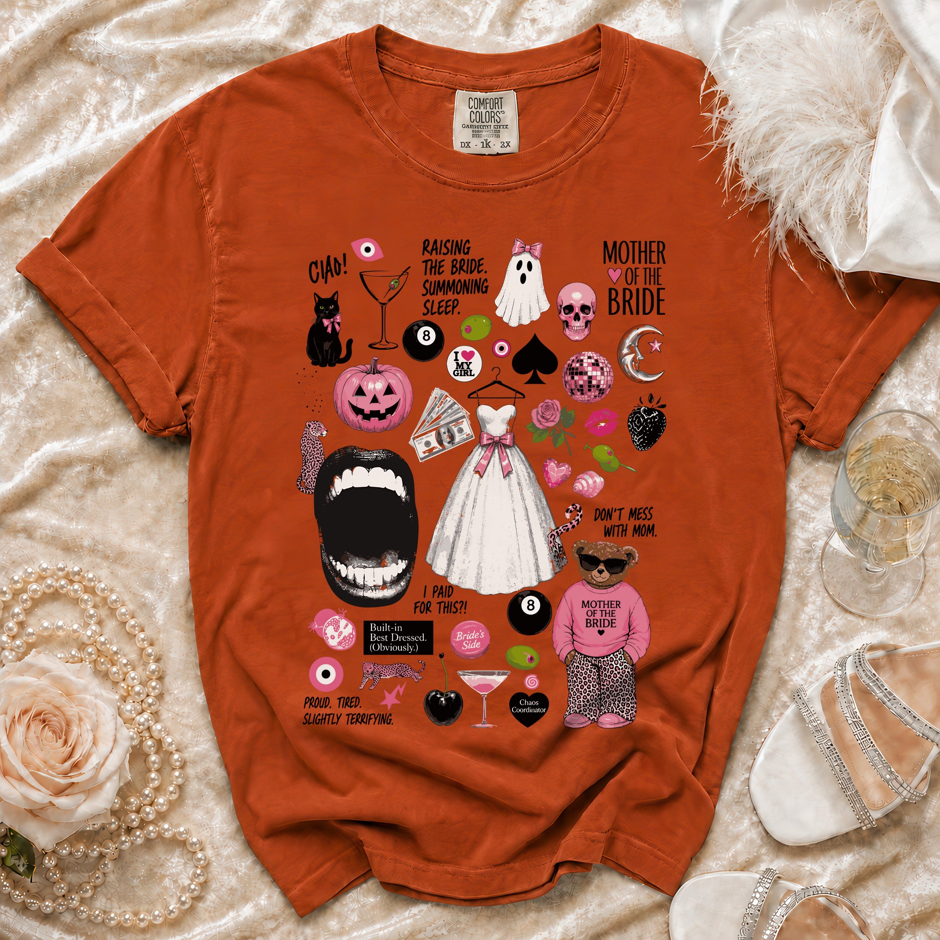 Orange Comfort Colors shirt with "Mother of the Bride" and wedding-themed illustrations.