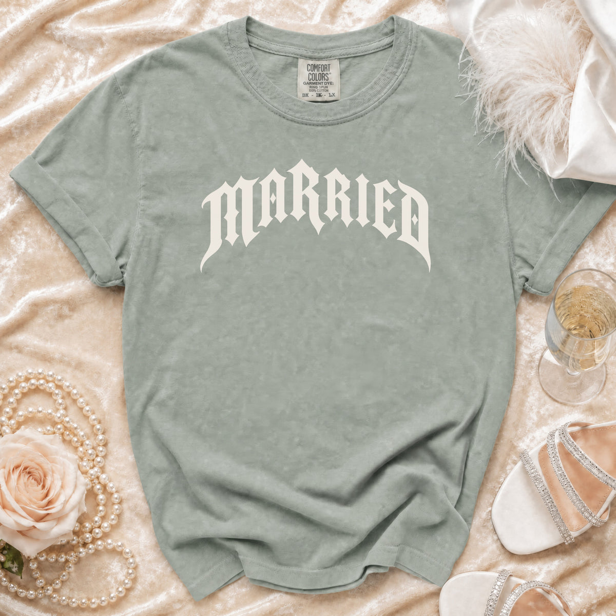 Light green t-shirt with "MARRIED" in off-white gothic font.