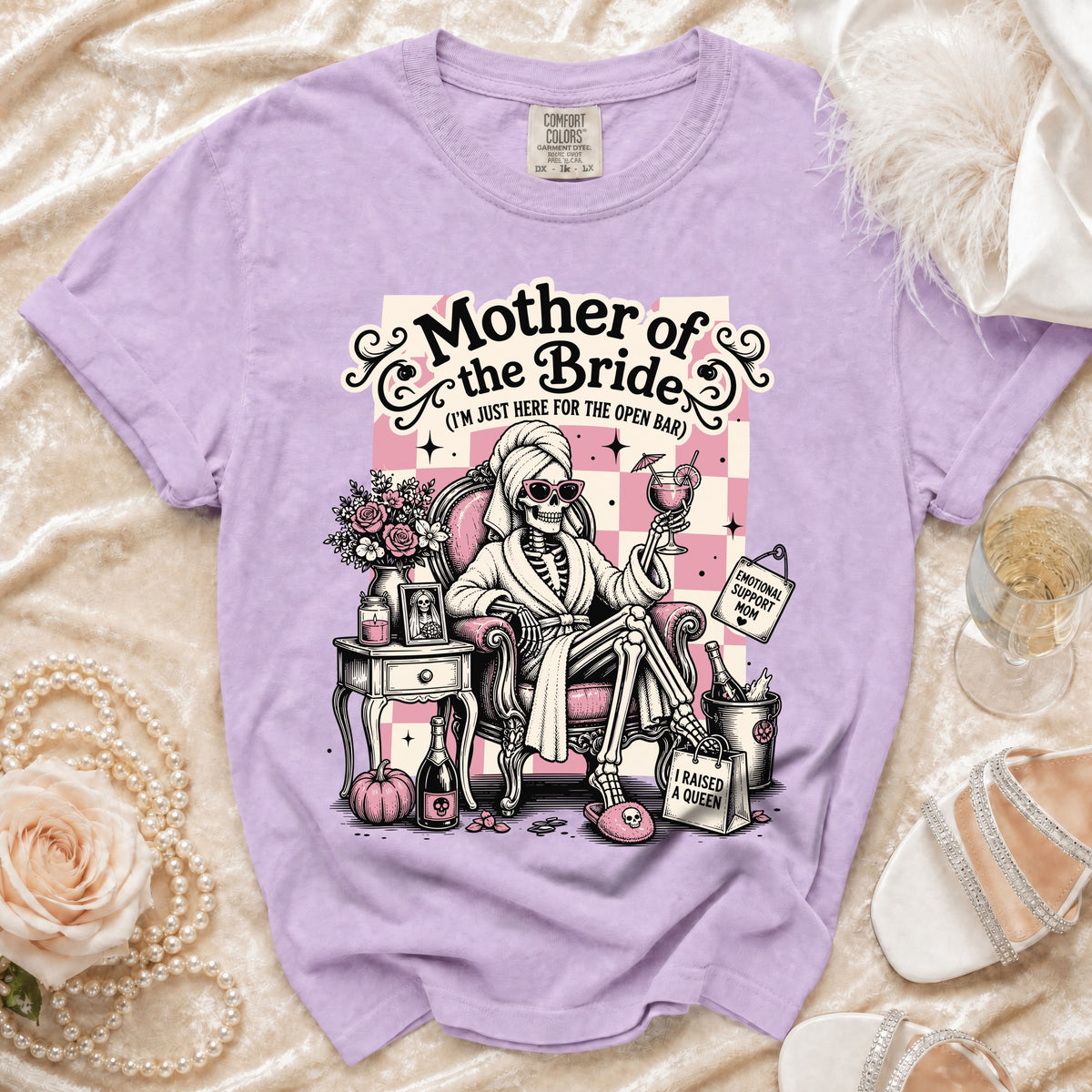 T-shirt with skeleton graphic and text "Mother of the Bride" and "I Raised A Queen."