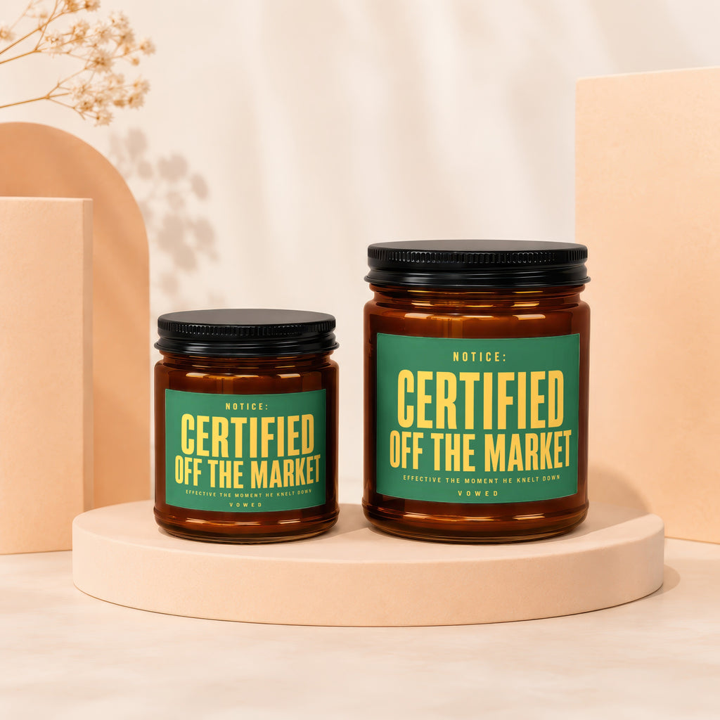 Two glass candles with green labels reading "Certified Off The Market" sit on pedestals.
