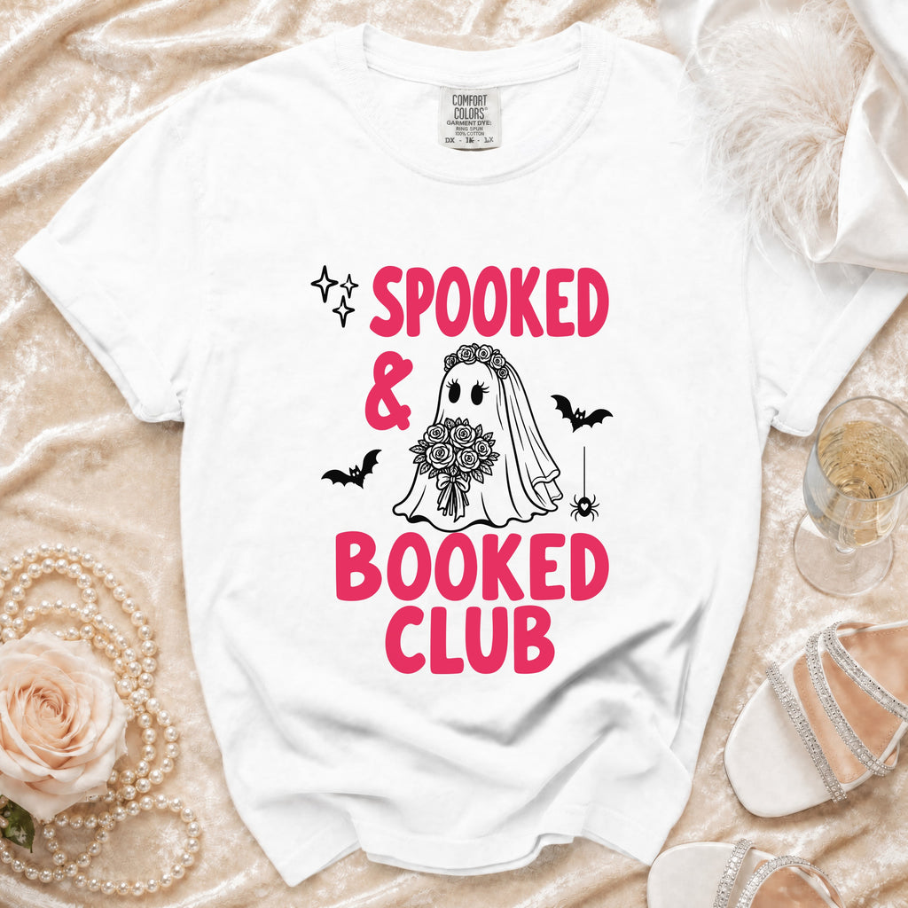 White t-shirt with "SPOOKED & BOOKED CLUB" text and bride ghost graphic.