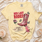Yellow t-shirt with "Her Last Rodeo" and cowboy boot graphic.
