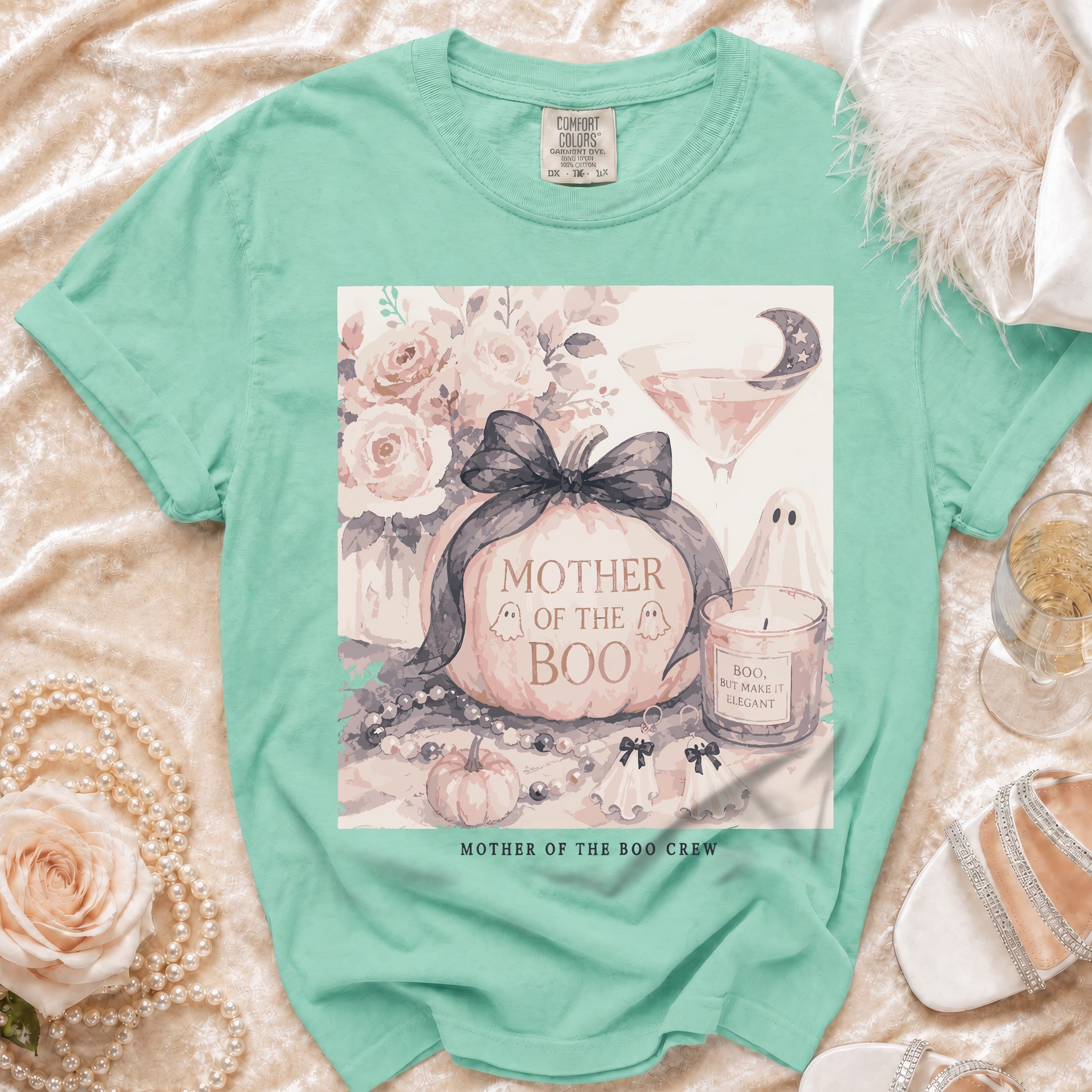 Mint green t-shirt with "Mother of the Boo Crew" Halloween graphic.