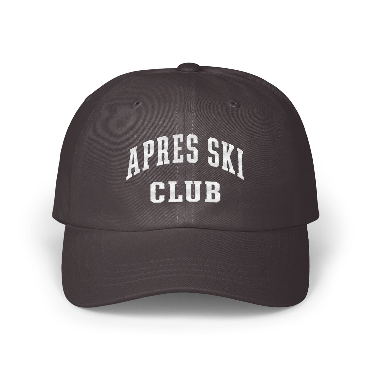 A dark grey baseball cap with white embroidered text reading APRES SKI CLUB on the front.
