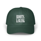 Dark green baseball cap with white embroidered text reading BOOTS & BLING on the front crown.