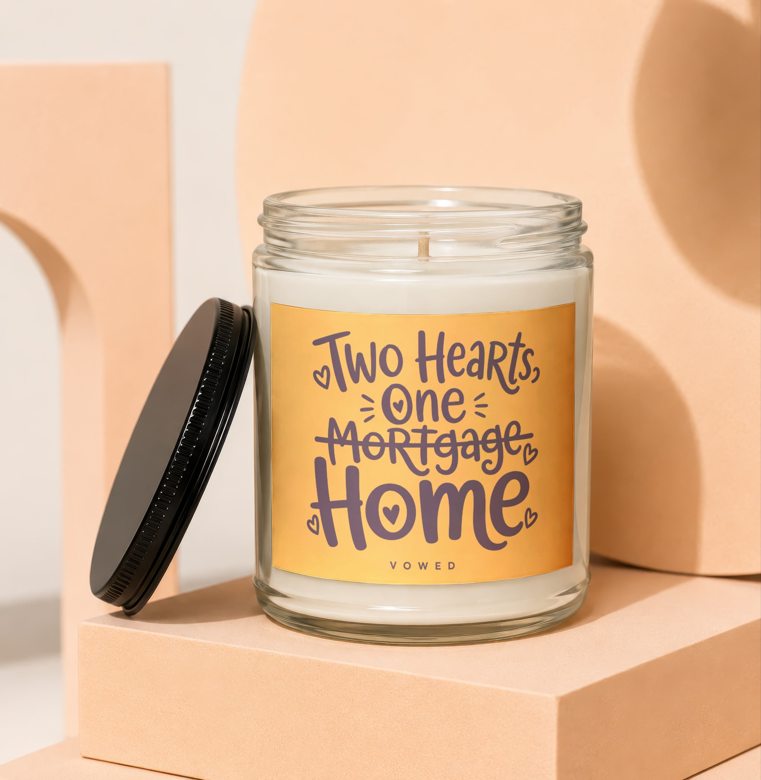 Candle with text "Two Hearts, One Mortgage, Home" and "vowed".