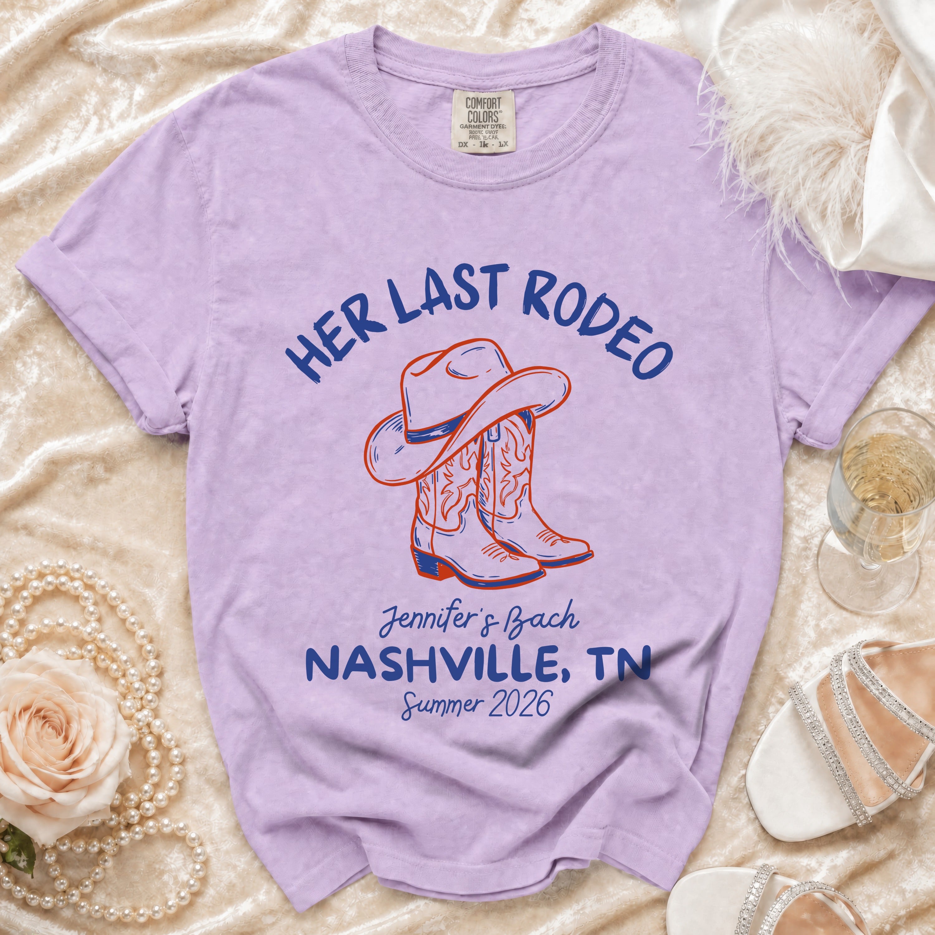 Purple t-shirt with "Her Last Rodeo" and cowboy boots graphic.
