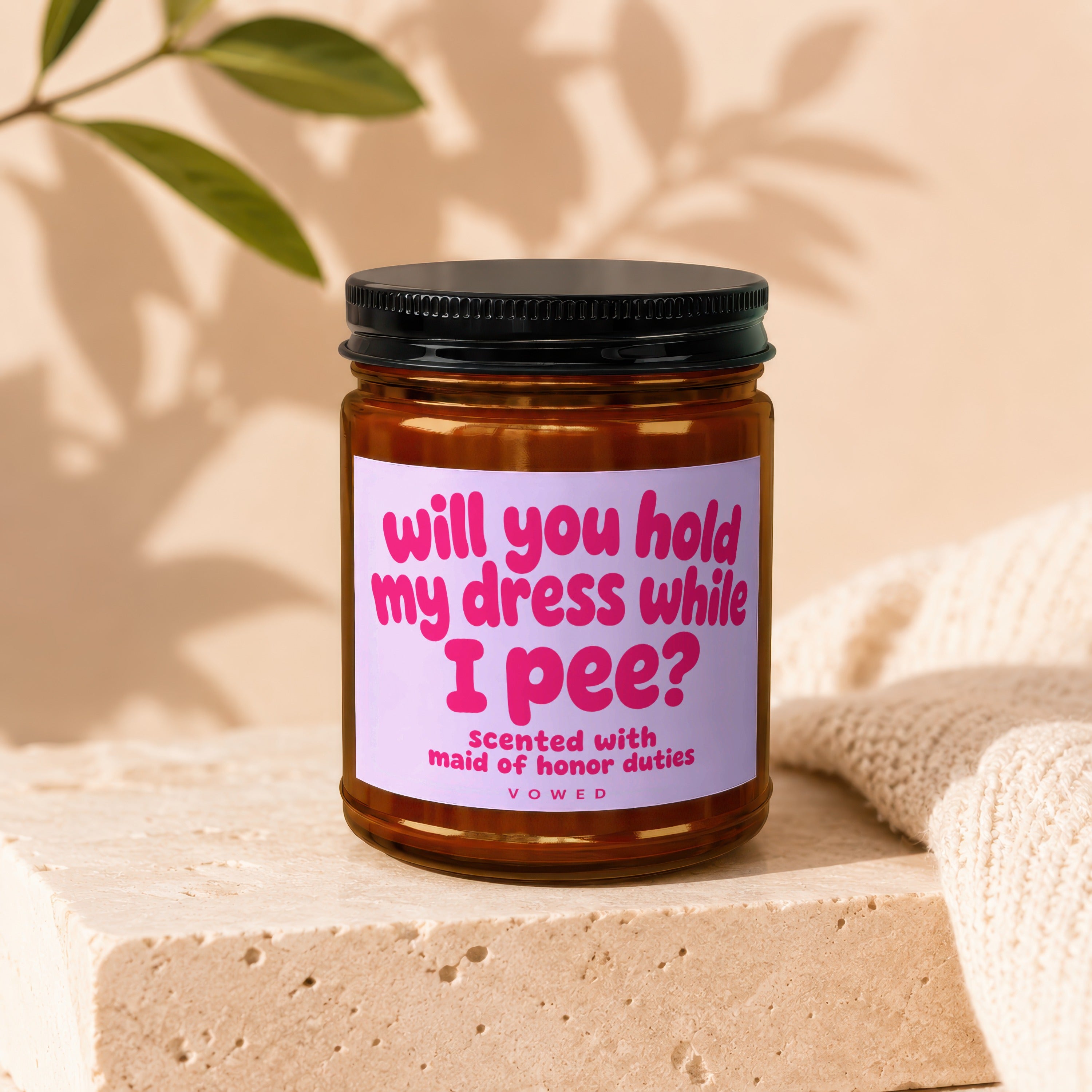 Candle with text "will you hold my dress while I pee?" scented with maid of honor duties.