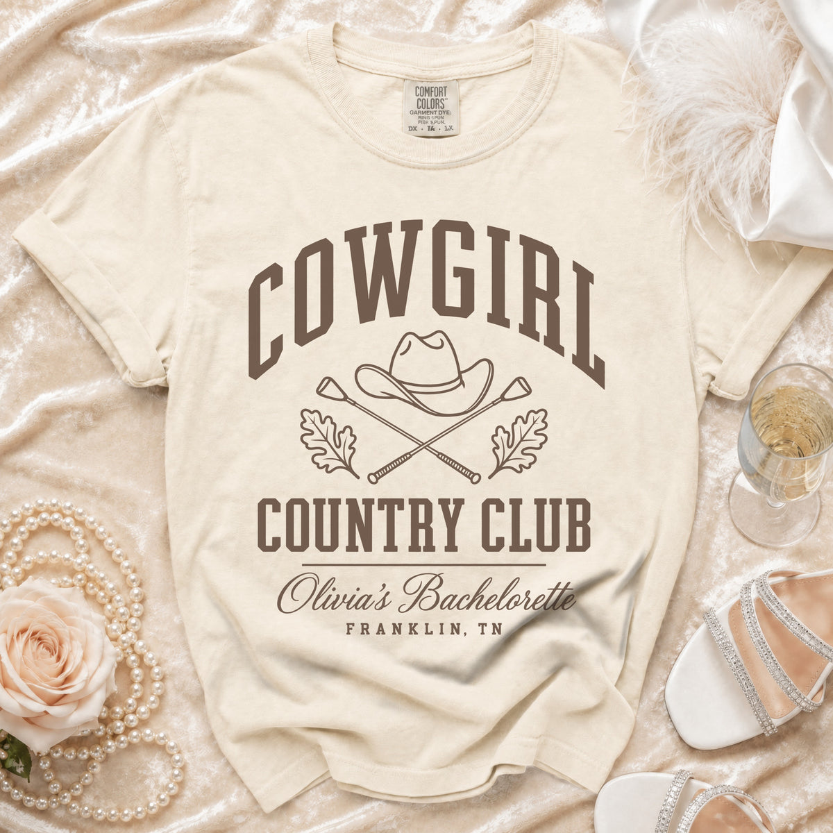 Cream t-shirt featuring brown text reading COWGIRL COUNTRY CLUB above Olivia's Bachelorette Franklin, TN.