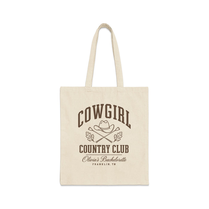 A light canvas tote bag featuring brown typography that reads Cowgirl Country Club, Olivia's Bachelorette, Franklin, TN.