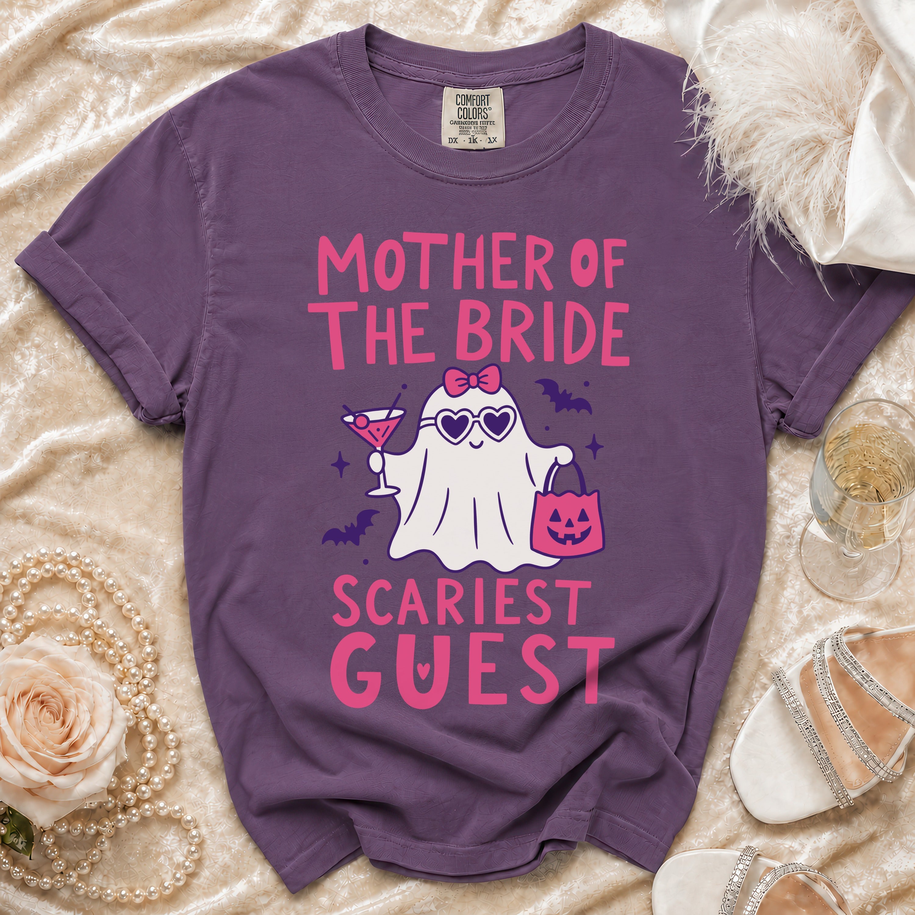 Purple t-shirt with "Mother of the Bride Scariest Guest" text and a ghost graphic.