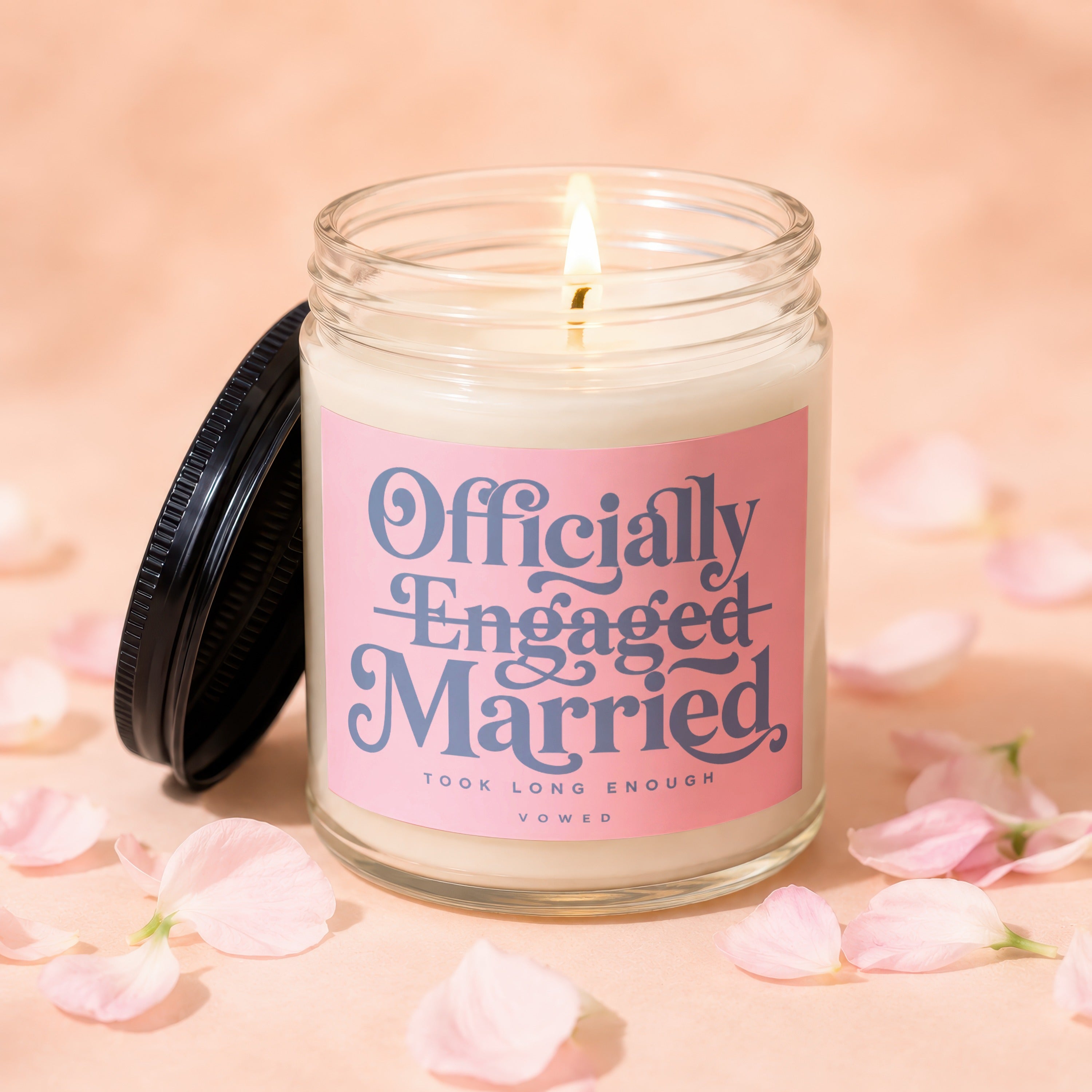 Candle with text "Officially Engaged Married Took Long Enough Vowed".