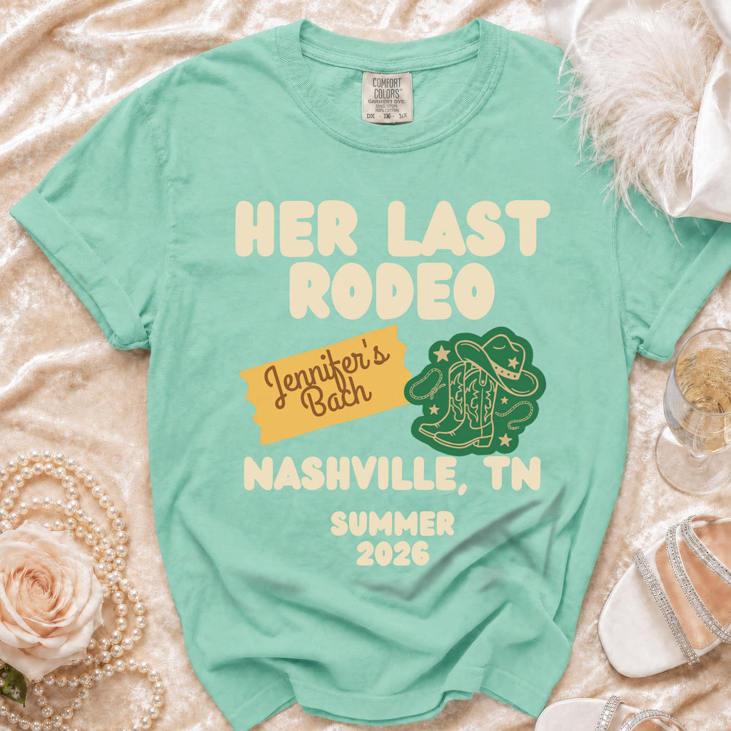 Mint green t-shirt with "Her Last Rodeo" text, cowboy boots, and Nashville, TN.