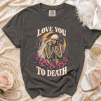 Dark grey t-shirt with "Love You To Death" skeleton couple graphic and Comfort Colors tag.