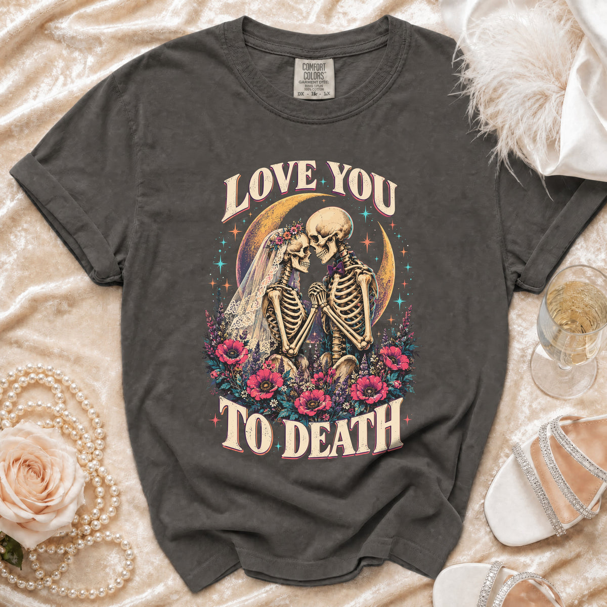 Dark grey t-shirt with "Love You To Death" skeleton couple graphic and Comfort Colors tag.