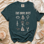 Green t-shirt with "This Bride Bites" and various gothic wedding illustrations.