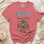 Coral t-shirt with "Reckless in Texas" and disco ball graphics.