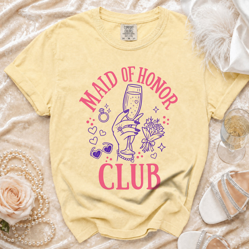 Yellow t-shirt with "Maid of Honor Club" text and graphic elements.