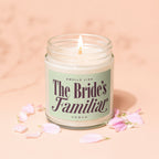 Candle with label that reads "Smells Like The Bride's Familiar Vowed", surrounded by petals.
