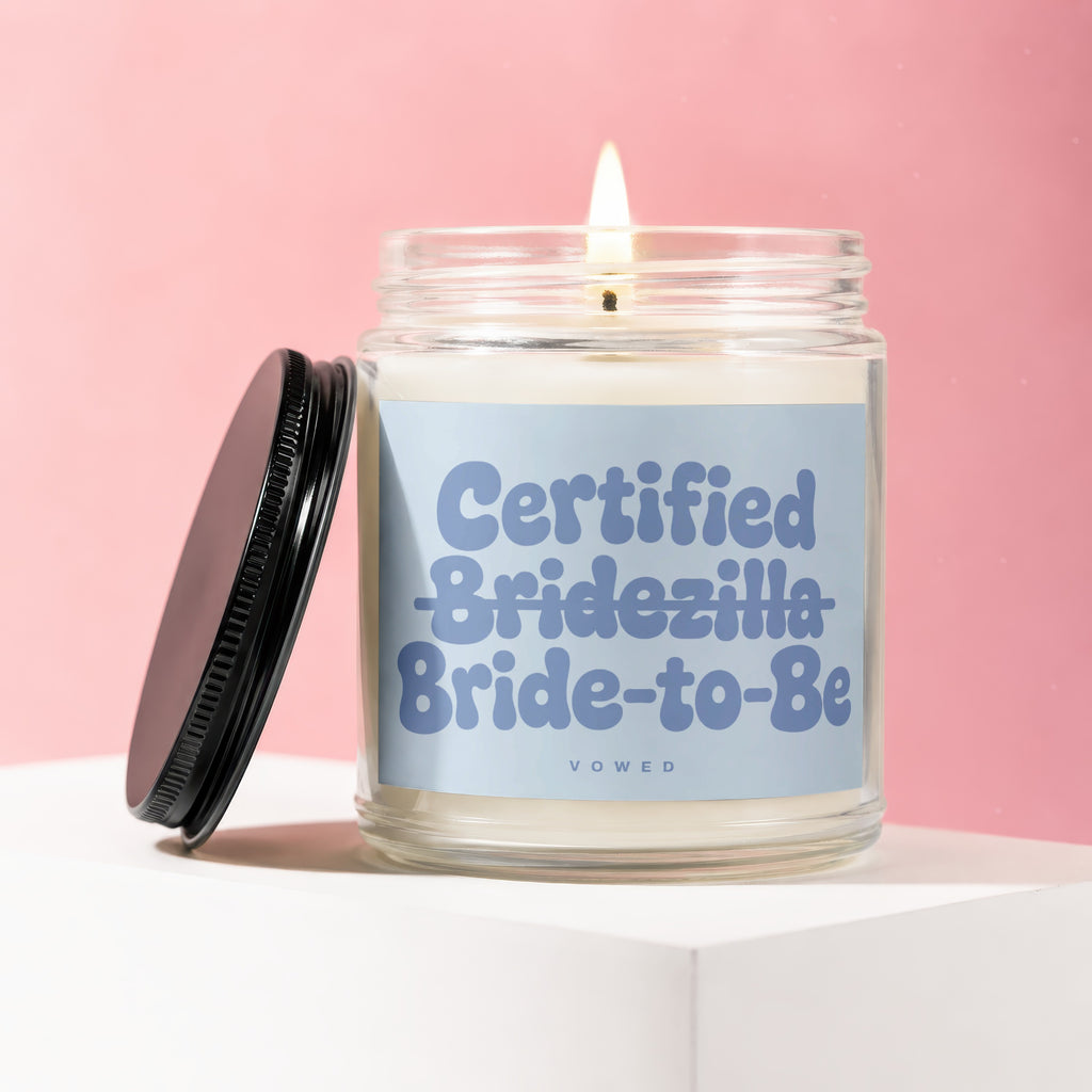 Candle with "Certified. Bridezilla Bride-to-Be" text and "vowed" logo on a pink background.