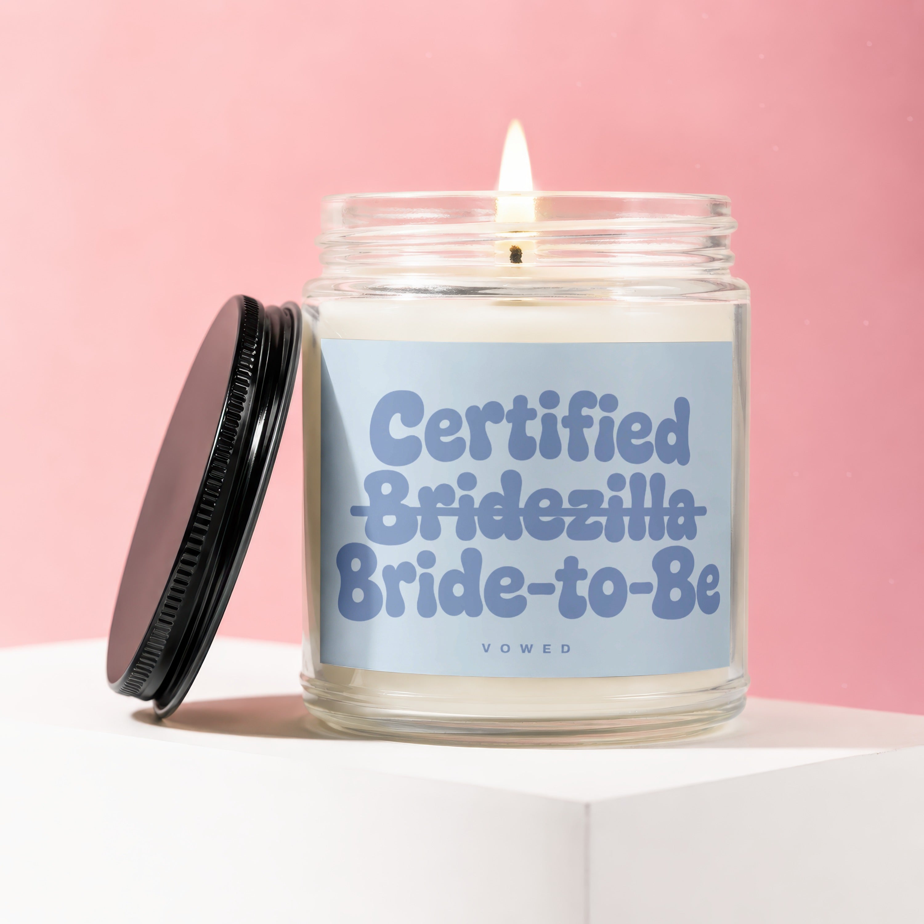 Candle with "Certified. Bridezilla Bride-to-Be" text and "vowed" logo on a pink background.