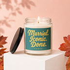 Candle with text "Married. Iconic. Done. Vowed." on a teal label.