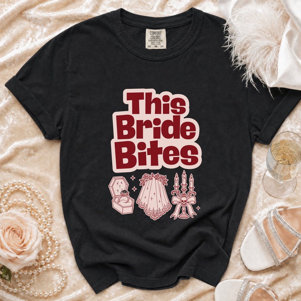 Black t-shirt with "This Bride Bites" text and wedding-themed graphics.