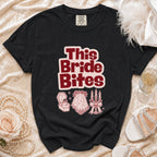 Black t-shirt with "This Bride Bites" text and wedding-themed graphics.