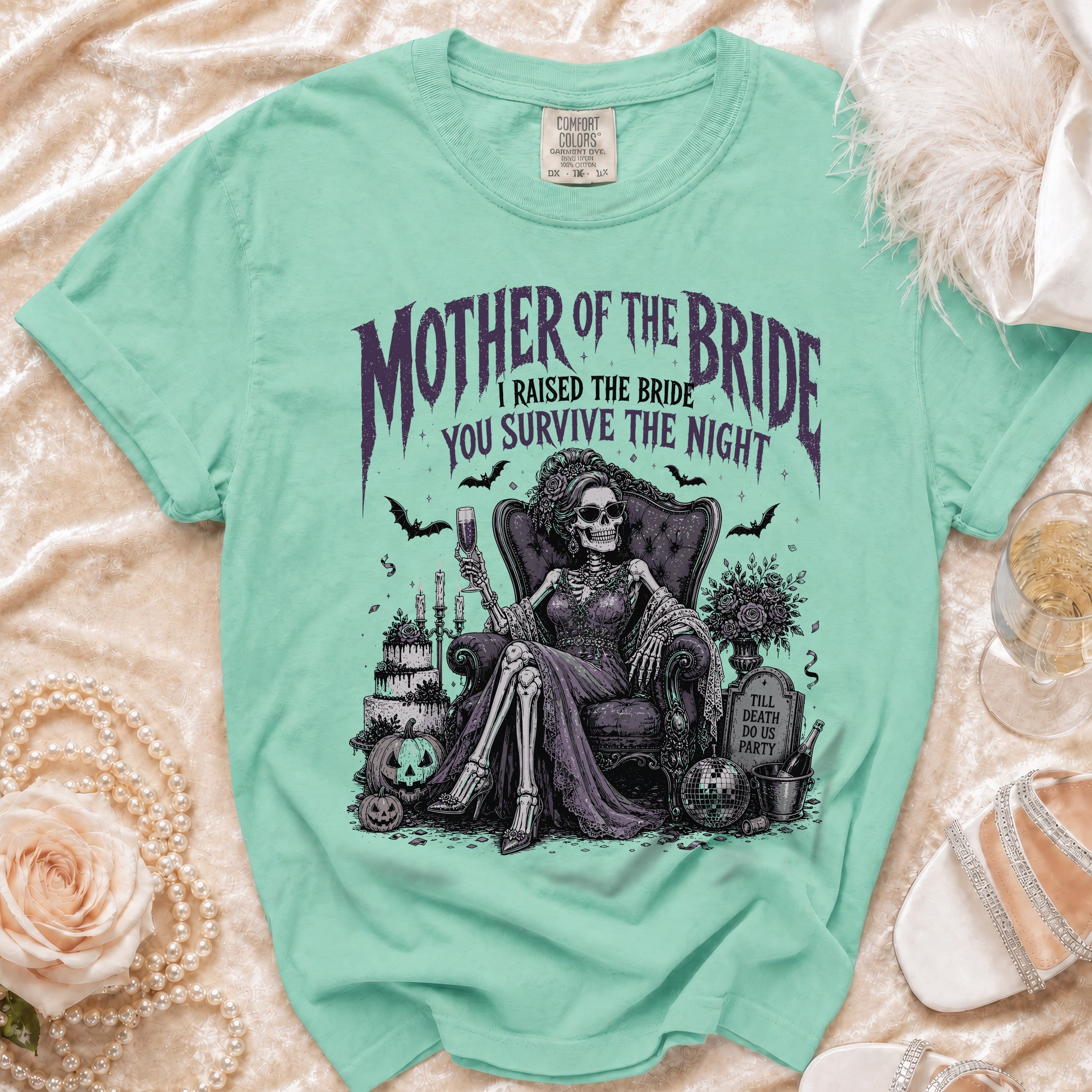 Mint green t-shirt with "Mother of the Bride, I Raised the Bride, You Survive the Night" text.