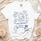 White t-shirt with blue cartoon ducks, "Last Splash", and event details.