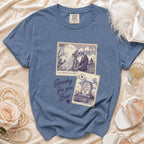 Blue t-shirt with skeleton wedding, tombstone, and text graphics.